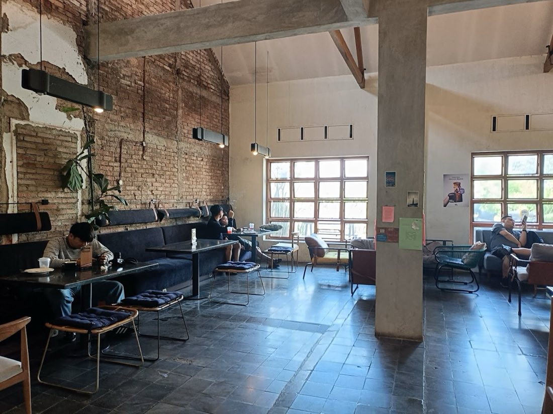Brick spine · concrete columns · workers stay long